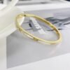 Elegant Zircon and Mother of Pearl Inlay Titanium Bangle