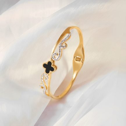 Stylish Scroll Bangle in Gold with Black and Crystal Accents