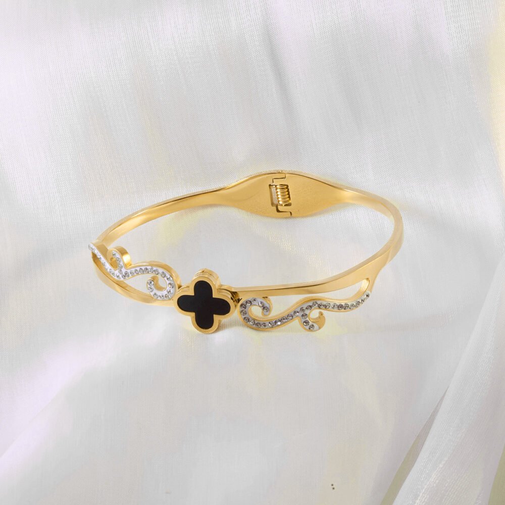 Stylish Scroll Bangle in Gold with Black and Crystal Accents