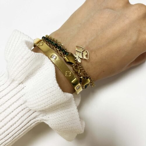 Festive Emerald Twist Bracelet with Bell Charm