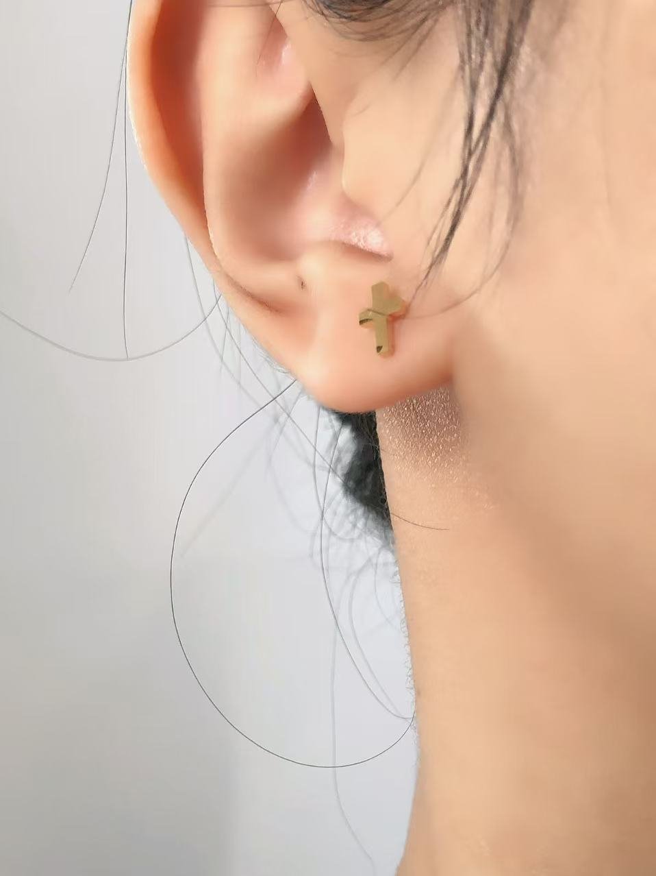Tiny Gold Cross Stud Earrings - Image 2